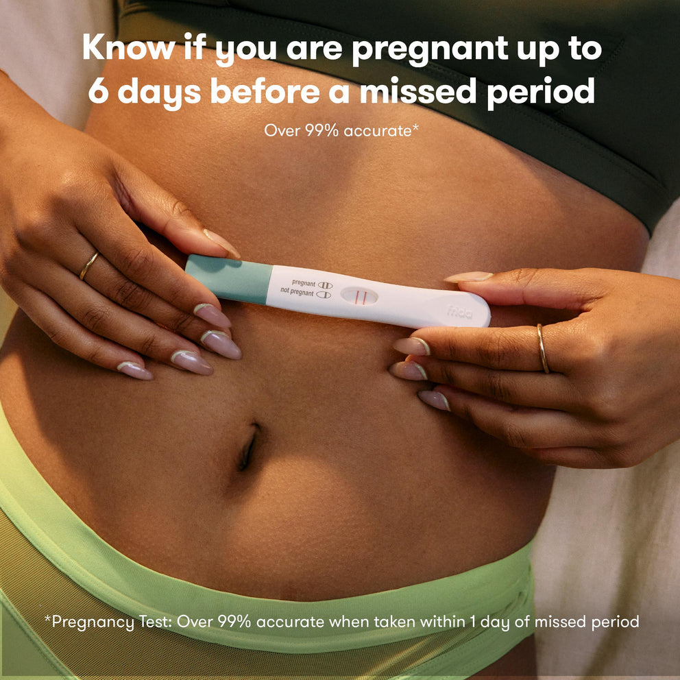 Women holding pregnancy stick